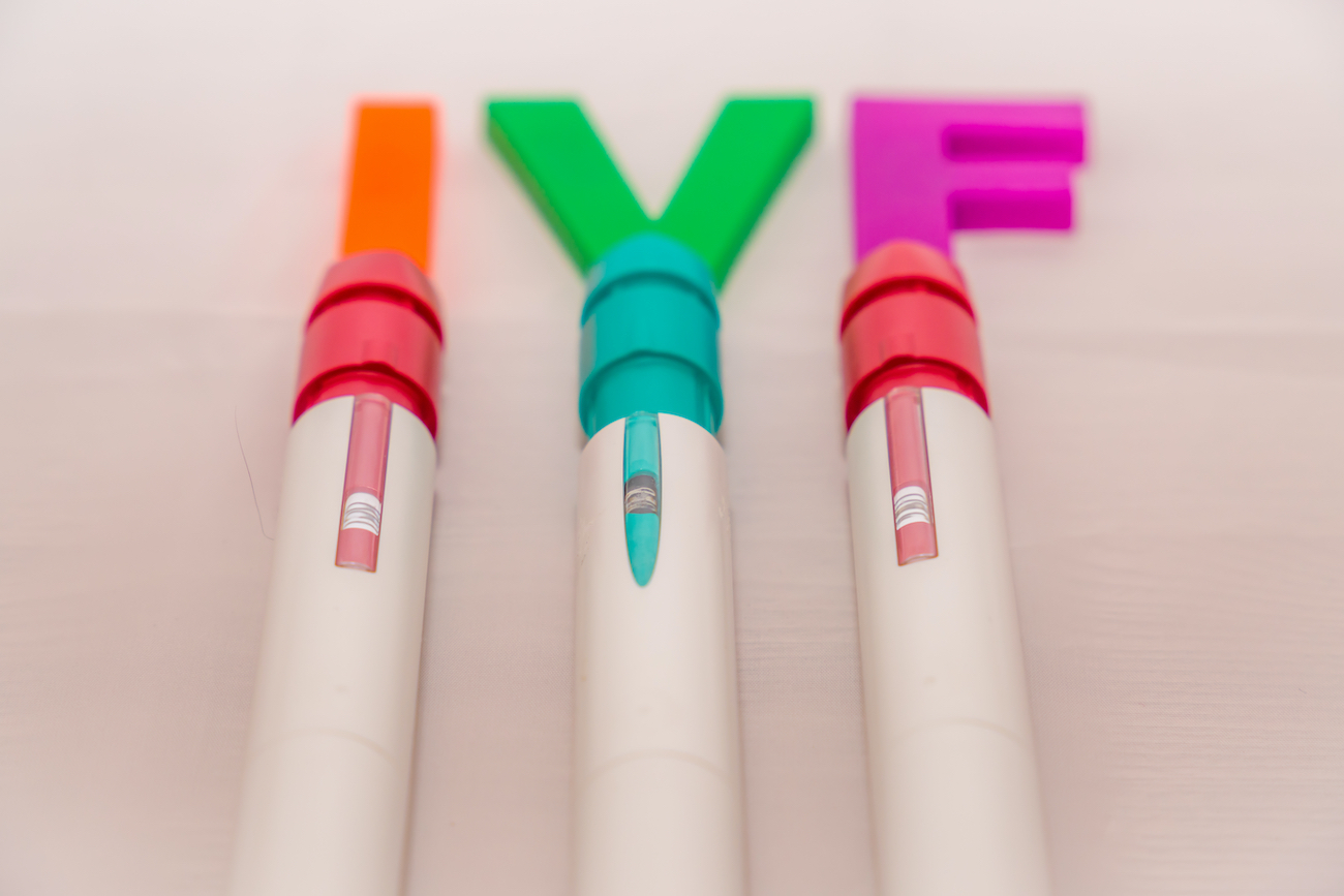 3 IVF injections with the letters IVF on top of them
