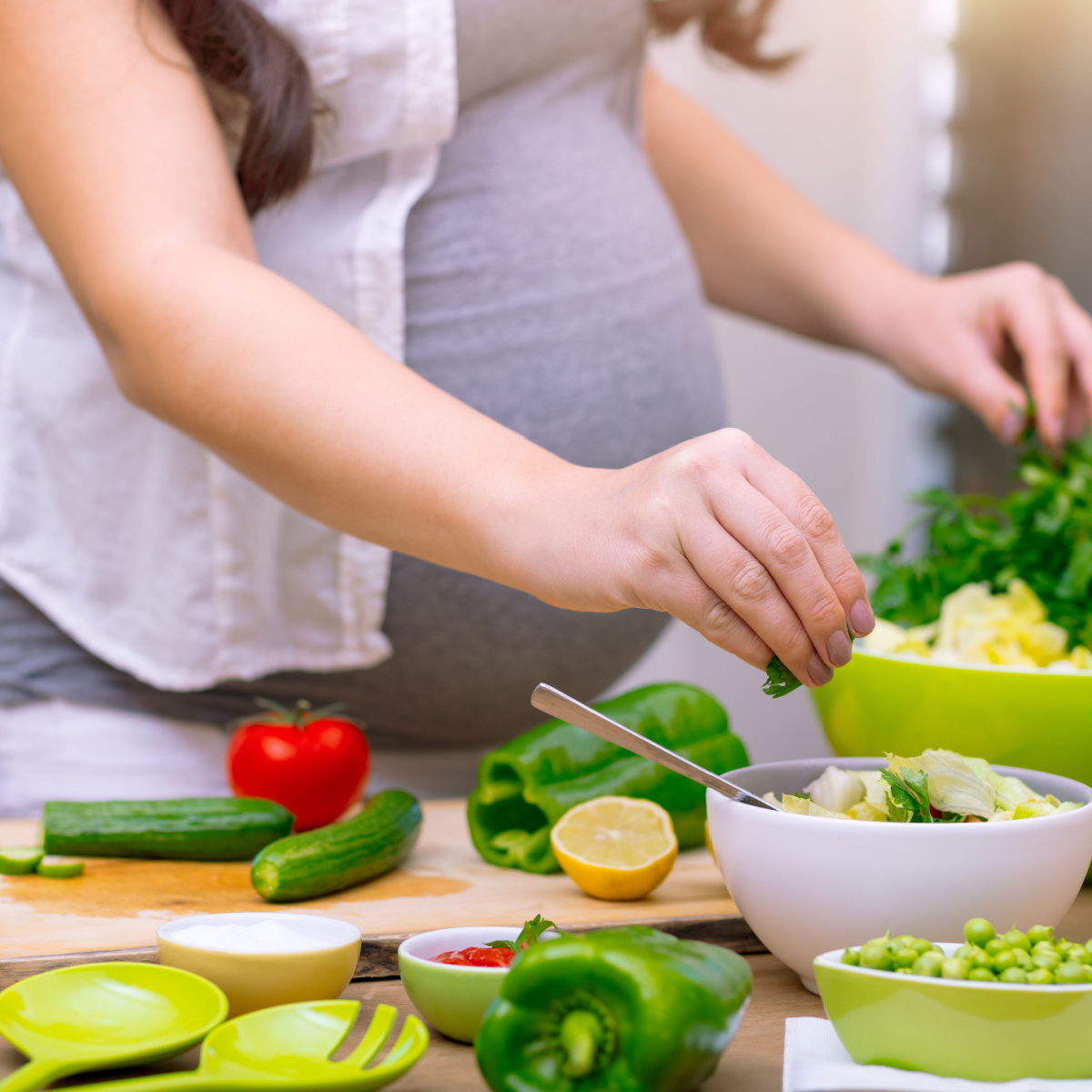 A pregnant woman eating healthy food
