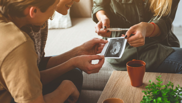A couple talking to their surrogate