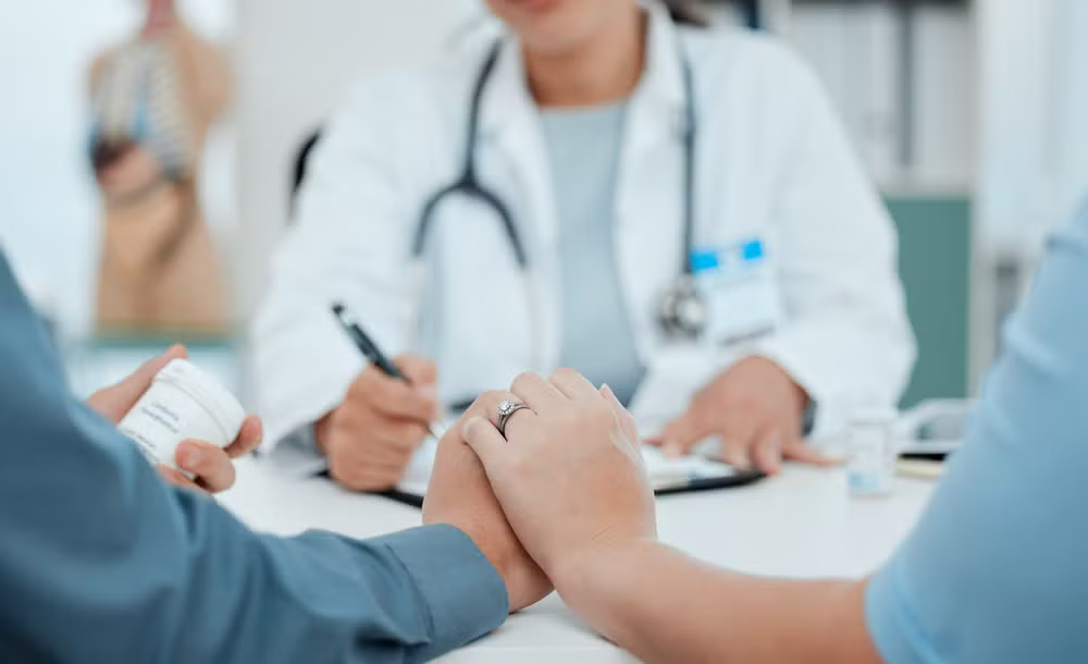 Couple in a consultation with a fertility doctor.