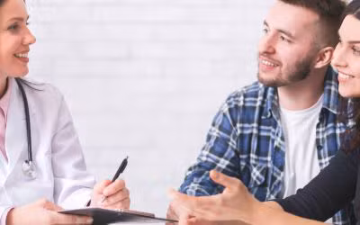 A couple talking to a the Woodlands IVF specialist