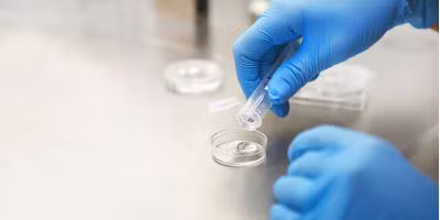 North Houston IVF specialist performing fertility testing procedure in lab