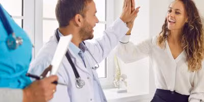A woman talking to a Kingwood IVF specialist