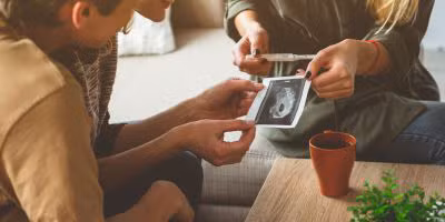A couple talking to their surrogate