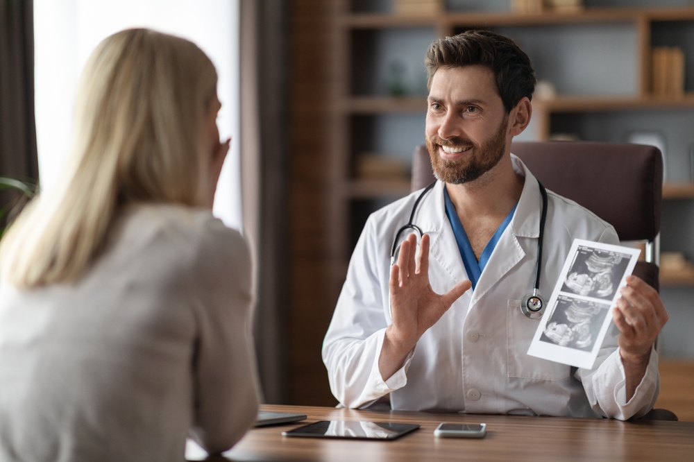 Fertility Doctor Talking to Female Patient