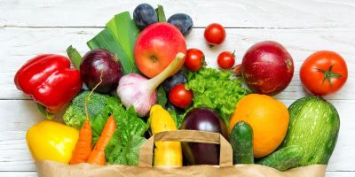 Grocery bag of fruits and vegetables to boost fertility