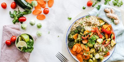 table covered in vegetables and a meal that may help boost fertility