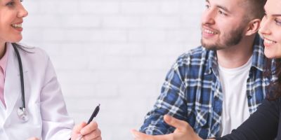 A couple talking to a the Woodlands IVF specialist
