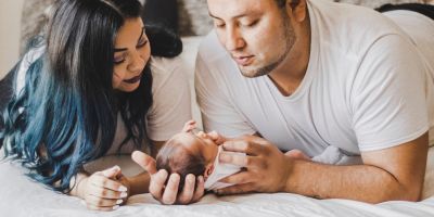 New parents looking at their newborn baby
