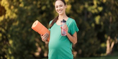 Pregnant woman exercising and living a healthy lifestyle for IVF success