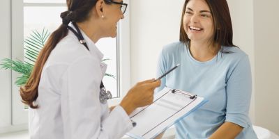 A gestational carrier talking to an IVF doctor