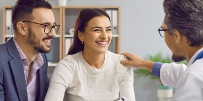 A couple talking to an IVF doctor