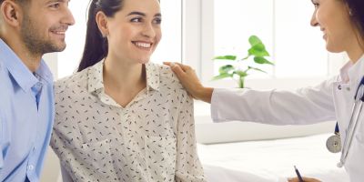 A couple talking to an IVF doctor